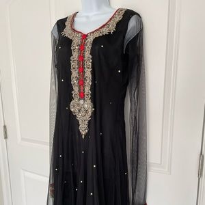 Black net gown with heavy embroidery